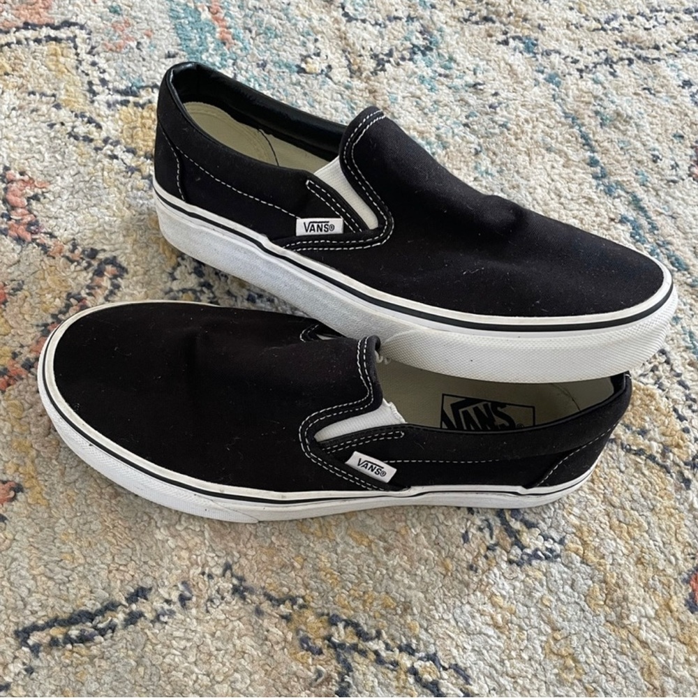 Black and white slip on vans